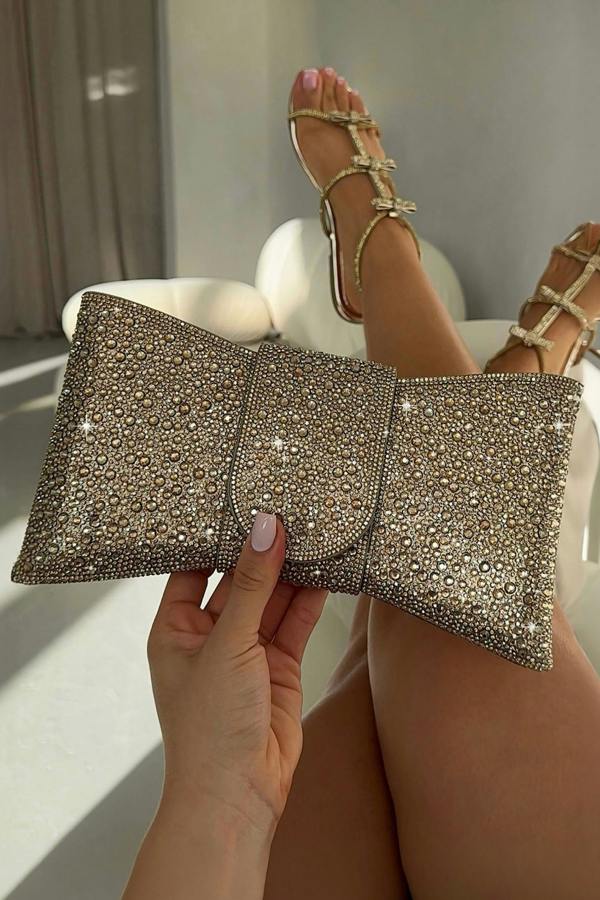 Crystal Luxe Bow Clutch Bag Gold with statement bow silhouette