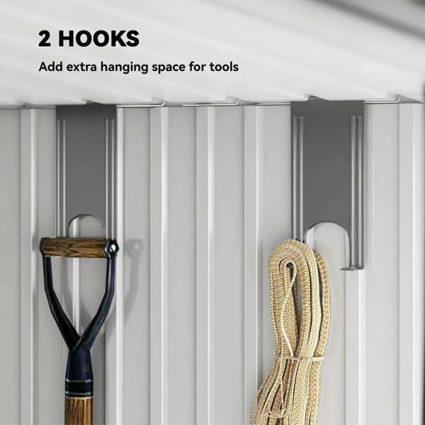 Grey metal shed interior wall with two hanging hooks for tools and cords