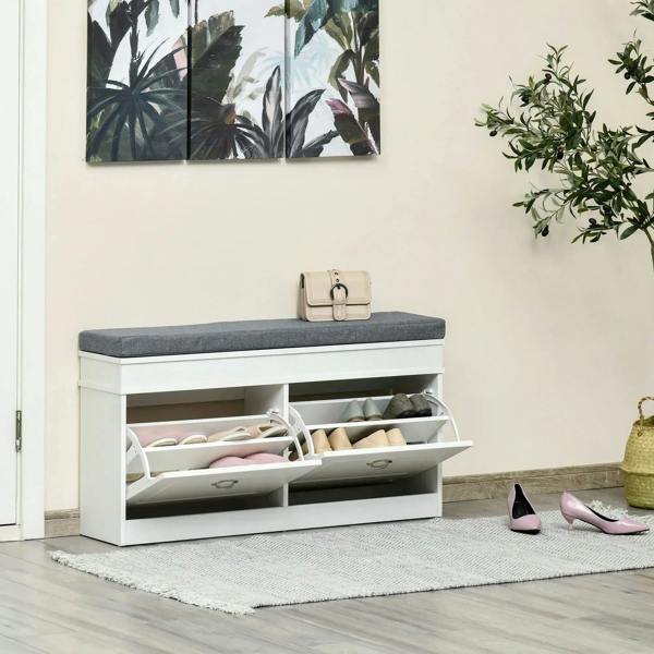 White shoe storage bench with gray seat cushion and open flip drawers holding shoes