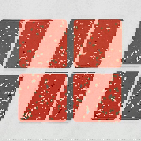 Set of 4 Recycled Plastic red Square Coasters, with black and white spots on them.