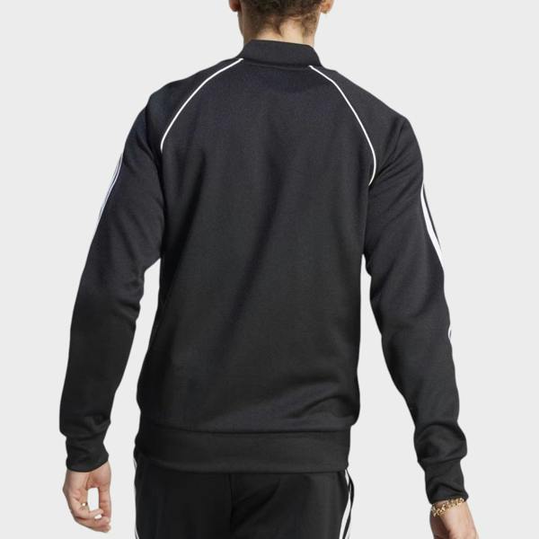 Back view of Supplied Fashion adidas Adicolor Classics Superstar track top in black with white three-stripe detail.