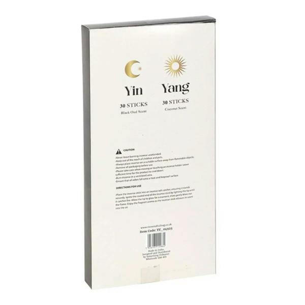 Back of a set of two yin-yang incense stick packs with caution and product details