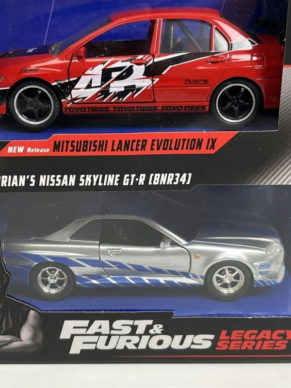 a two toy cars in boxes