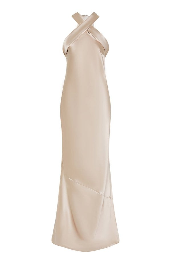 Champagne satin halterneck bridesmaids and black tie wedding guest occasion wear dress.
