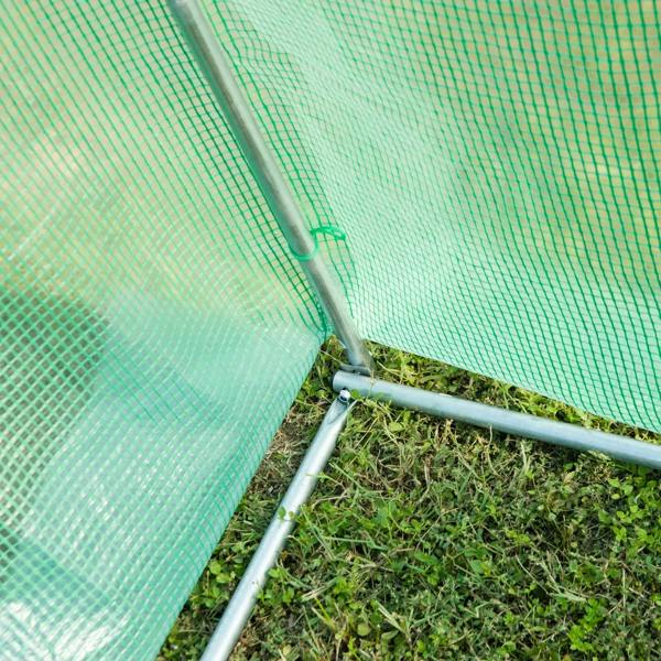 Green greenhouse corner with metal support frame and PE cover edge