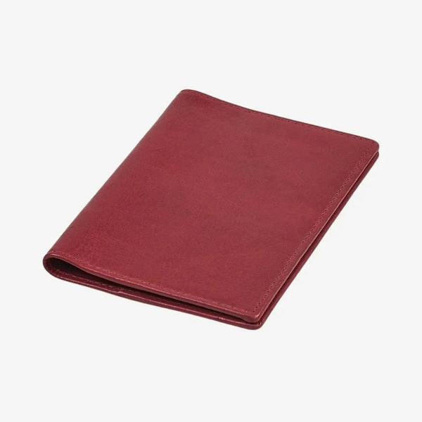 Top view of  Bordeaux leather passport holder on a white background