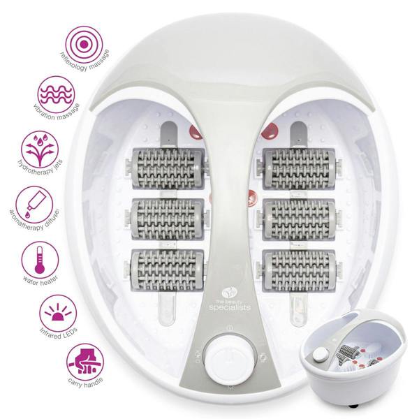 The Rio Deluxe Foot Spa Bath and Massager features an oval gray and white design with six textured rollers, vibration massage, hydrotherapy, aromatherapy, water heating, infrared LEDs, and a convenient carry handle.