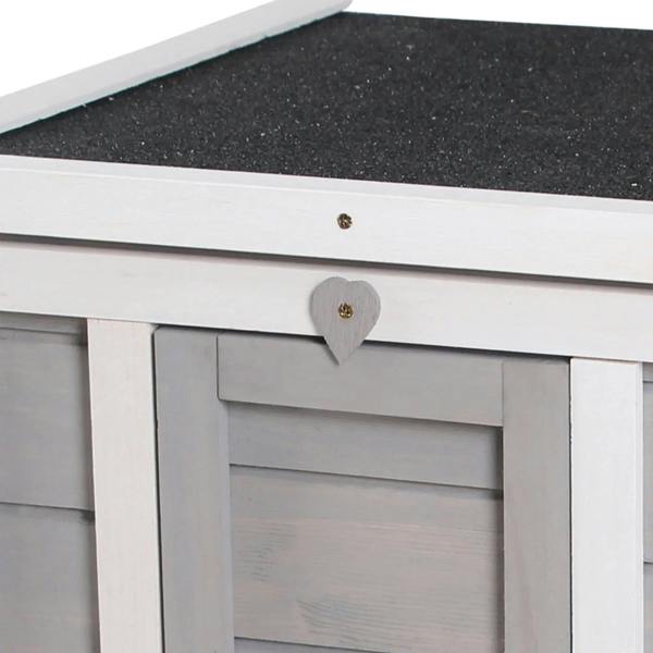 Grey wooden hutch close-up of open roof latch and handle above front doorway