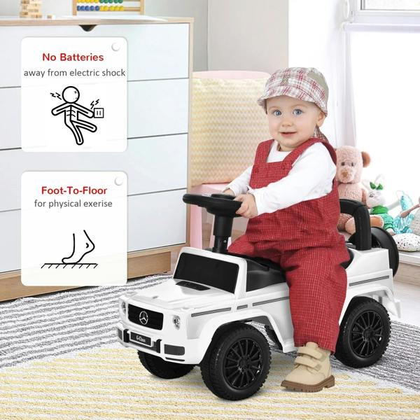 White kids ride-on car with black seat, used with toddler foot-to-floor