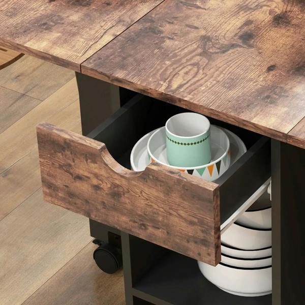 Rustic brown drop-leaf folding table with side drawer holding stacked white plates.