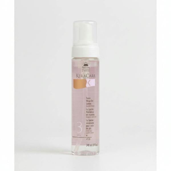 A pump bottle of Keracare Foam Wrap Set Lotion Extra Hold, 240ml, with a pink label.
