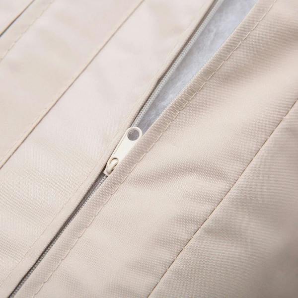 Beige sofa cushion close-up showing zipper seam and stitched fabric panels