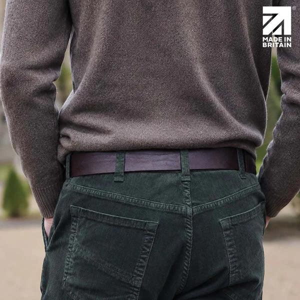 Rear view of a men’s brown 40mm leather belt worn with dark trousers