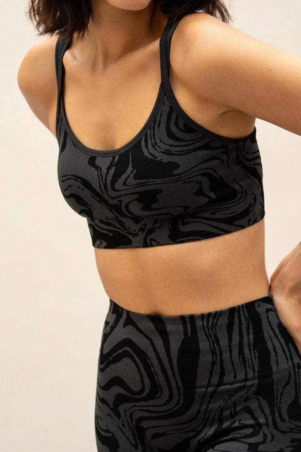 Black grey charcoal recycled seamless marble print low to medium impact supportive sports bra for yoga, pilates, spinning, weights, running and exercise.