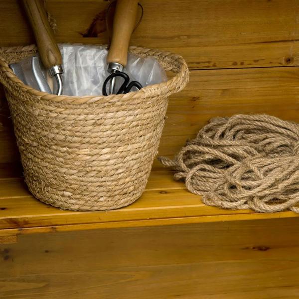 Interior view of natural wood shelves with woven basket storage