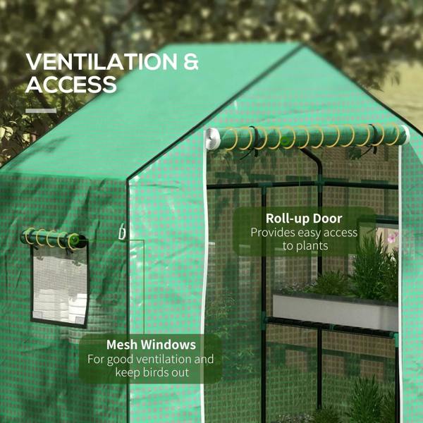 Green greenhouse cover with roll-up door and mesh windows for ventilation and access