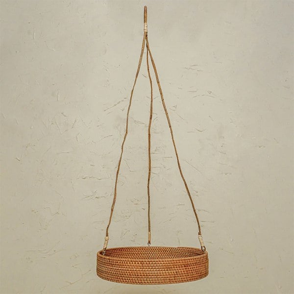 Natural rattan hanging plant basket lifestyle indoor plant display
