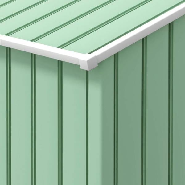 Light green metal shed wall panels with white trim along the roof edge