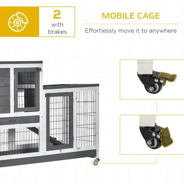 Grey wooden mobile rabbit hutch with wire compartments and front openings, on locking casters