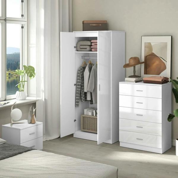 White high-gloss wardrobe open with hanging clothes and matching drawer dresser