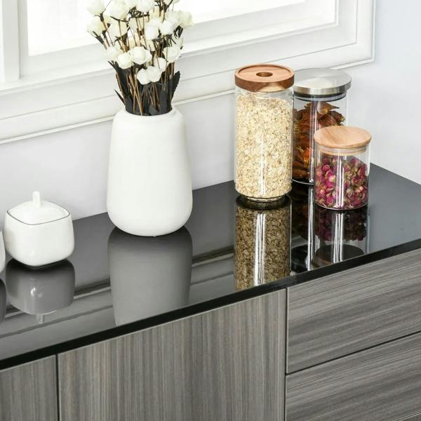 Light grey side cabinet top with decorative jars and storage drawers, clean front panels