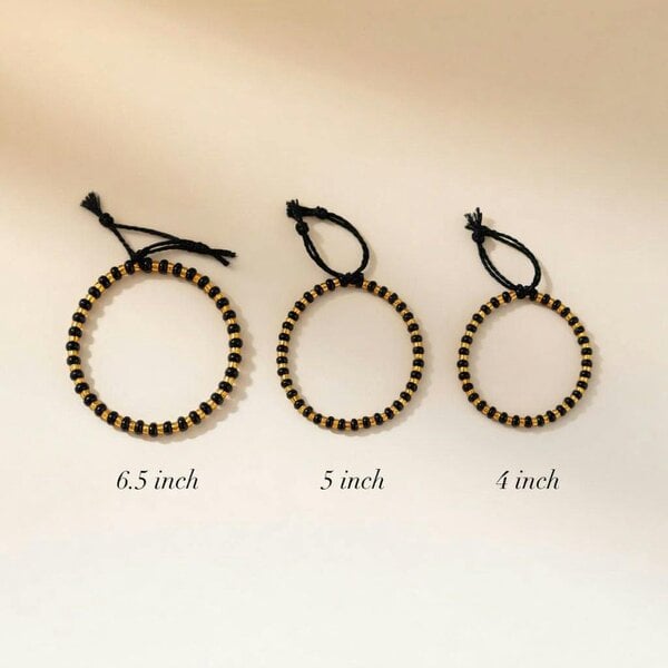 The Colourful Aura Adjustable Gold Black Beads Bracelet For Newborns and Adults