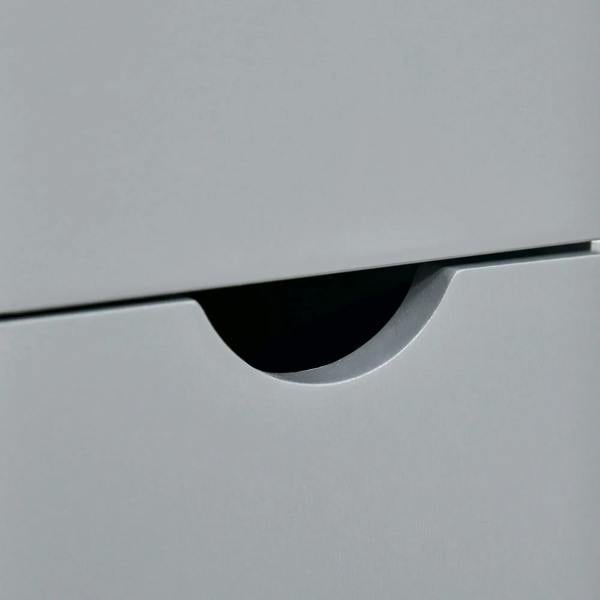 Grey cabinet drawer with curved black handle pull.