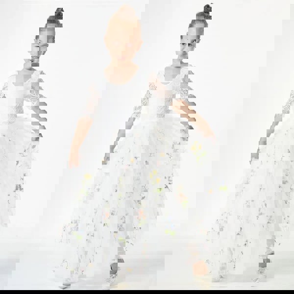 young girl modelling a white dress from uk flower girl boutique