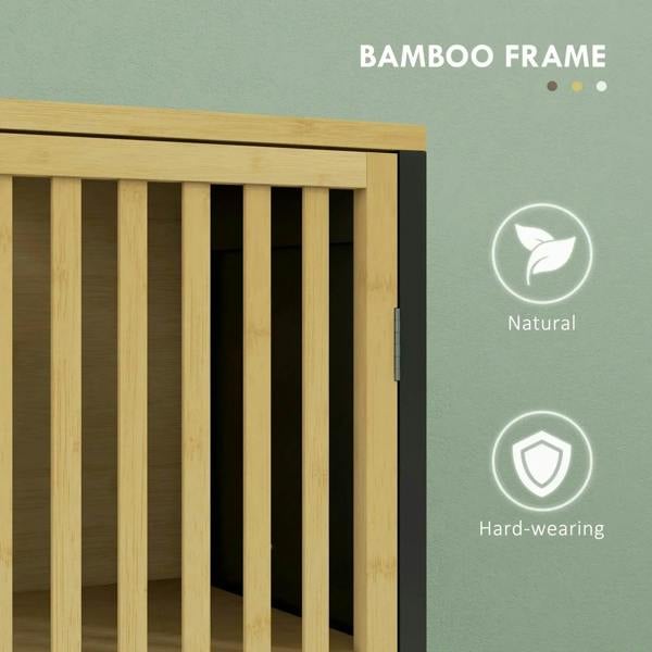Close-up of bamboo-framed slat door and natural wood top rail on under sink cabinet