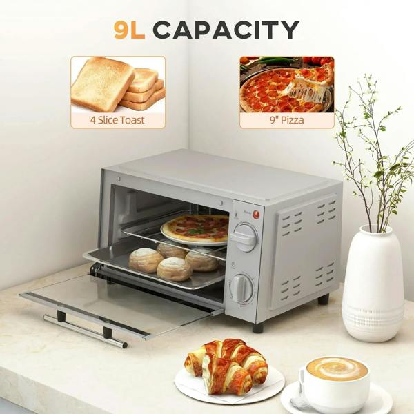 Silver 9L mini oven with door open, wire rack and tray holding baked foods.