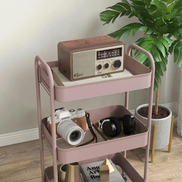 Pink three-tier steel storage trolley with raised edges and rounded handles