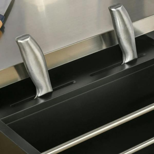 Knife rack on stainless top with black kitchen island cart front