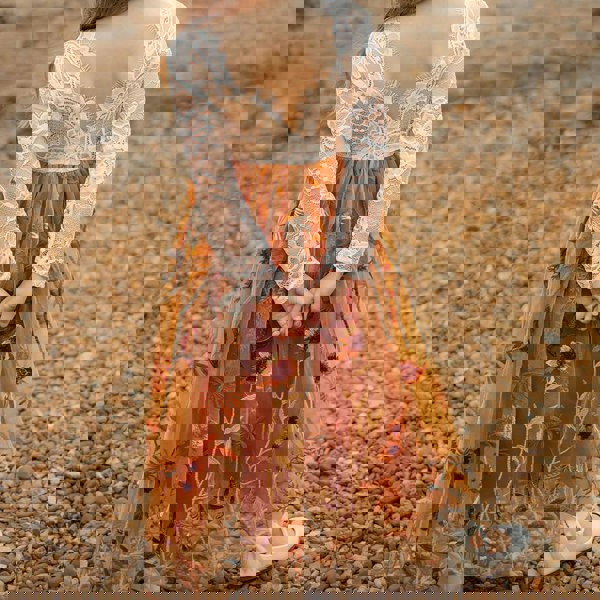 young girl wearing embroidered dress