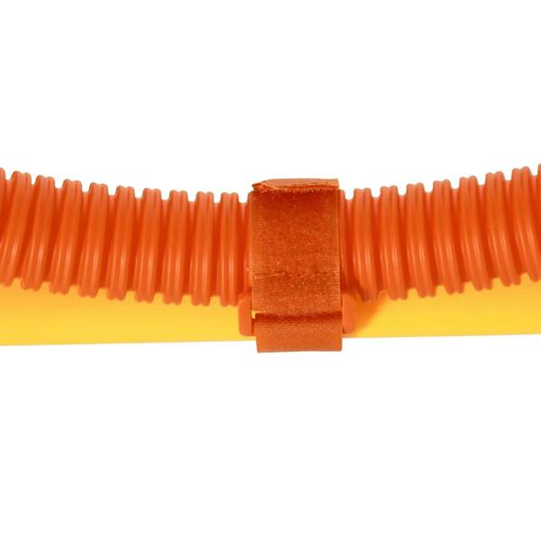 Orange coil connector with textured plastic clip between yellow poles