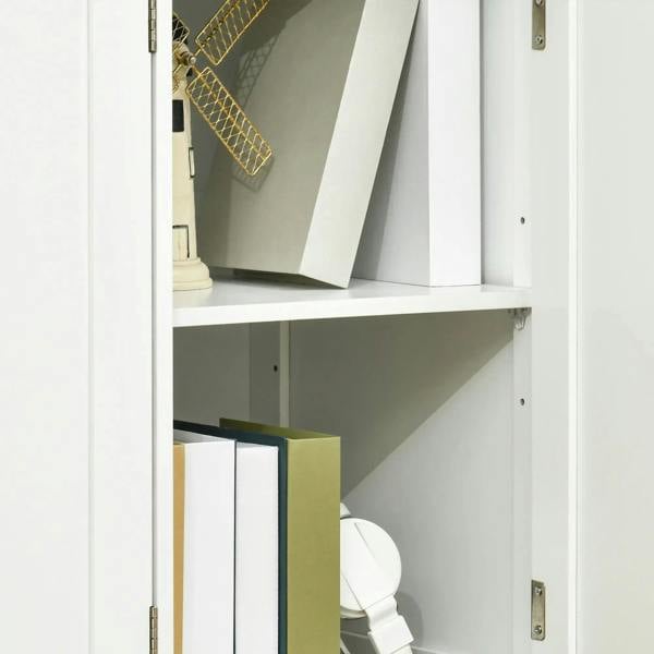 White cabinet interior with side hinge and shelf storage area behind a door opening