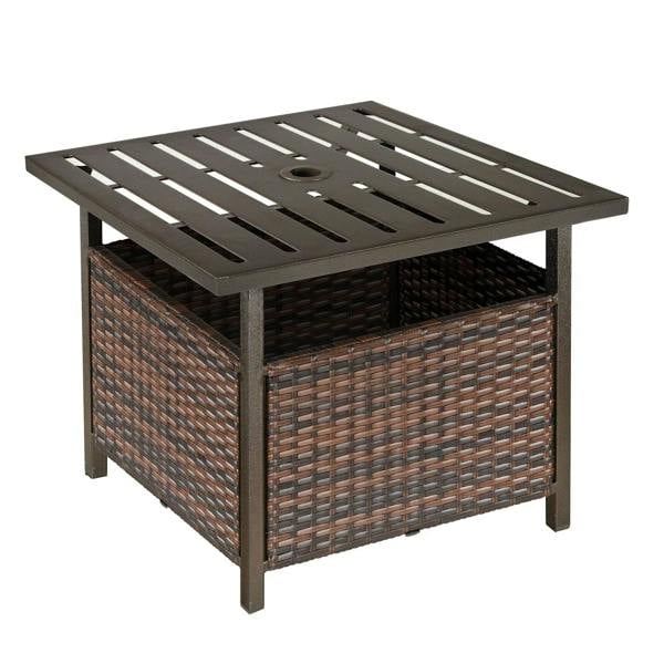 Brown rattan coffee table with dark slatted metal top and round umbrella hole