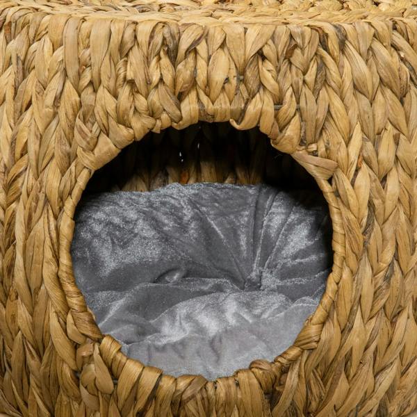 Front doorway of a wicker cat bed with a grey cushion inside