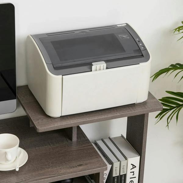 Grey desktop shelf of computer desk with side drawer storage compartment