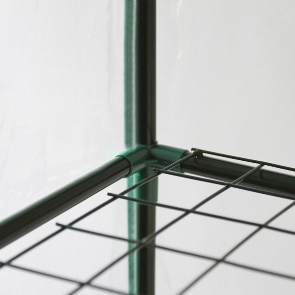 Mini greenhouse with four tiers, featuring a sturdy black wire shelf and a clear plastic cover for optimal plant growth