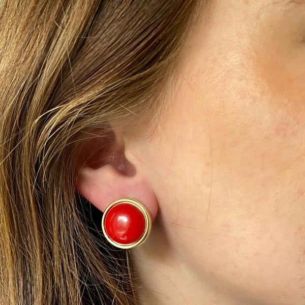 Red and gold clip-on earrings, round dome design, glossy red centre, gold-tone border, bold statement jewellery, vintage-inspired accessory
