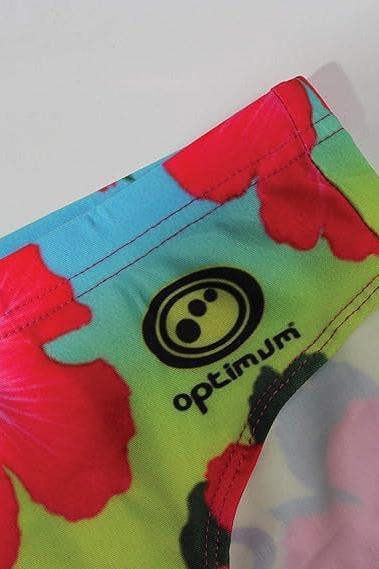 Optimum Tackle Trunks swim brief, close-up of hip with black Optimum logo on neon hibiscus floral print - Optimum