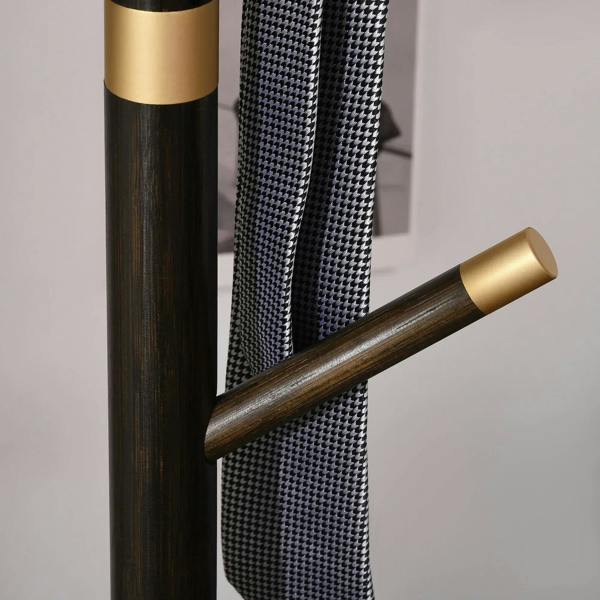 Freestanding coat rack stand with dark bamboo pole and angled hook bar with gold ends