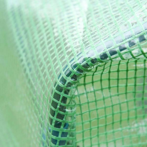 Green PE greenhouse cover netting close-up with stitched grid pattern.