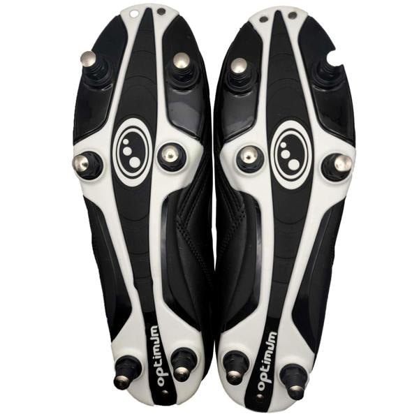 Underside of black and white Optimum Razor football boots showing six screw-in studs, on white - Optimum
