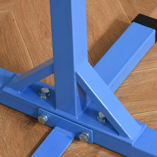 Close-up of blue base frame with bolts and sturdy triangular support for a horizontal bar
