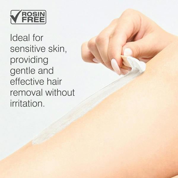 A hand peels Rio Coconut Go Smooth Stripless Hard Wax Beads (100g) from smooth skin, showing it’s rosin-free and ideal for sensitive skin, providing gentle, effective hair removal without irritation.