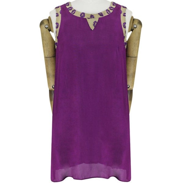 An embroidered lip and mesh edged dress by Giles