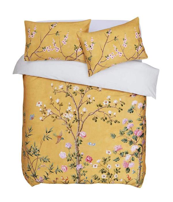 Opulent and artistic, M.M Linen Yuki design of charming blossoms and fauna on a sunny and soft, golden background