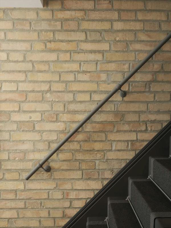 Luddington textured grey straight flight handrail close up showing brackets