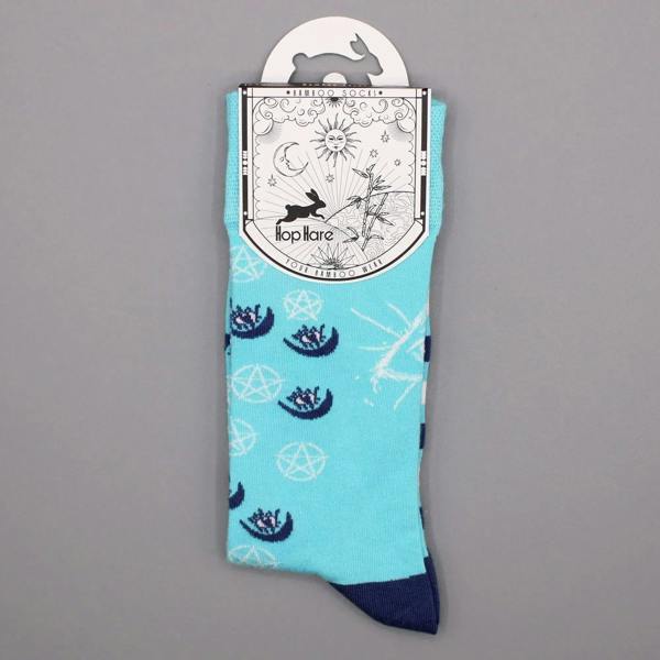 Turquoise crew socks with evil eye and pentagram motifs, navy cuff and toe